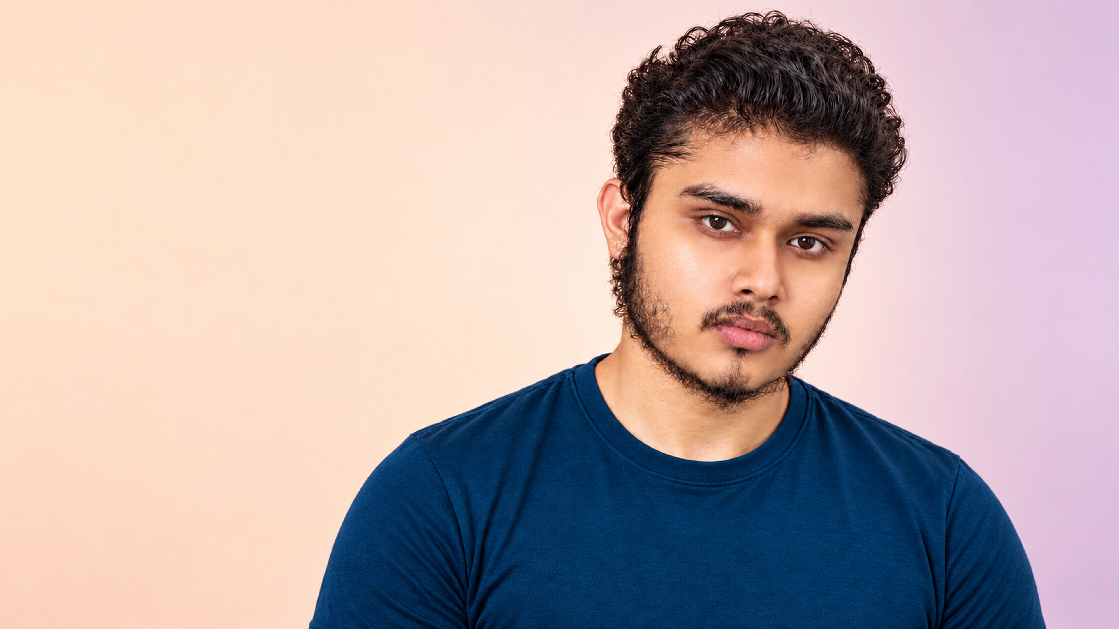 Sayan Mondal in a colorful studio portrait